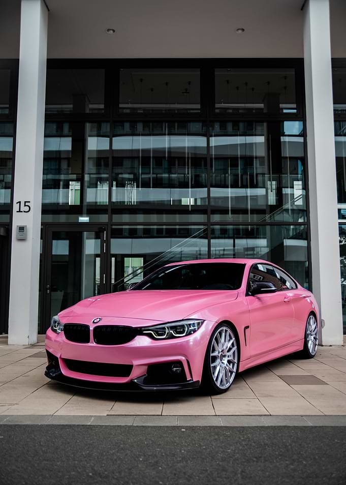Pink BMW F32 Coupe in Modern Setting
