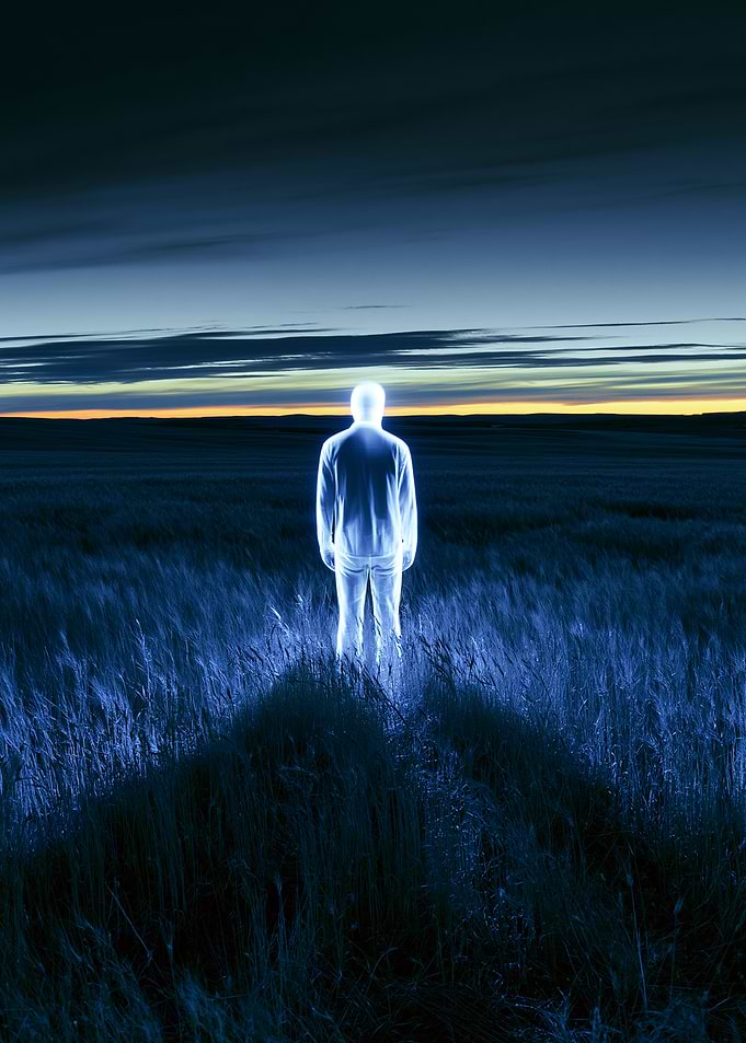 Glowing Figure in a Field at Dusk