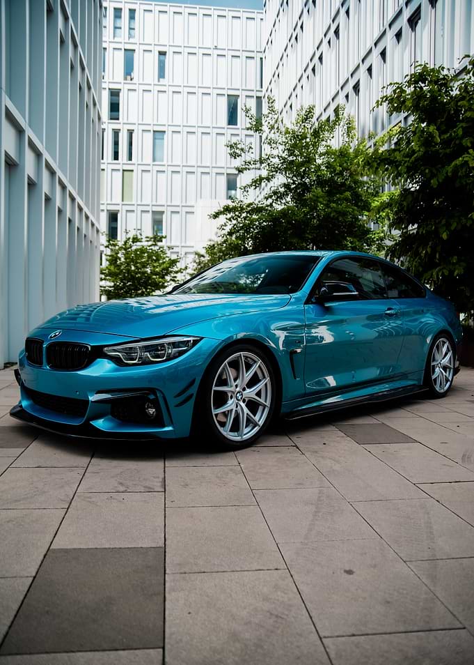 Blue BMW F32 Coupe in Modern City