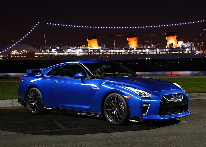 Blue Nissan GT-R at Night with Ship