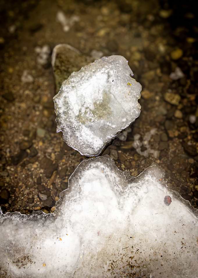 Ice formations on a rocky riverbed