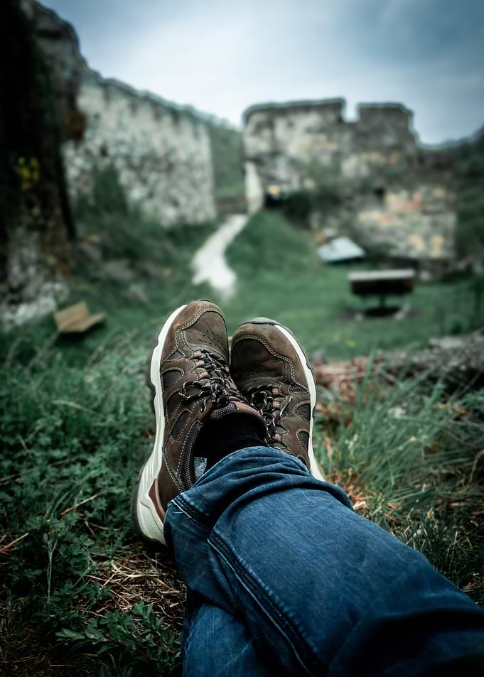 Person relaxing at ancient ruins