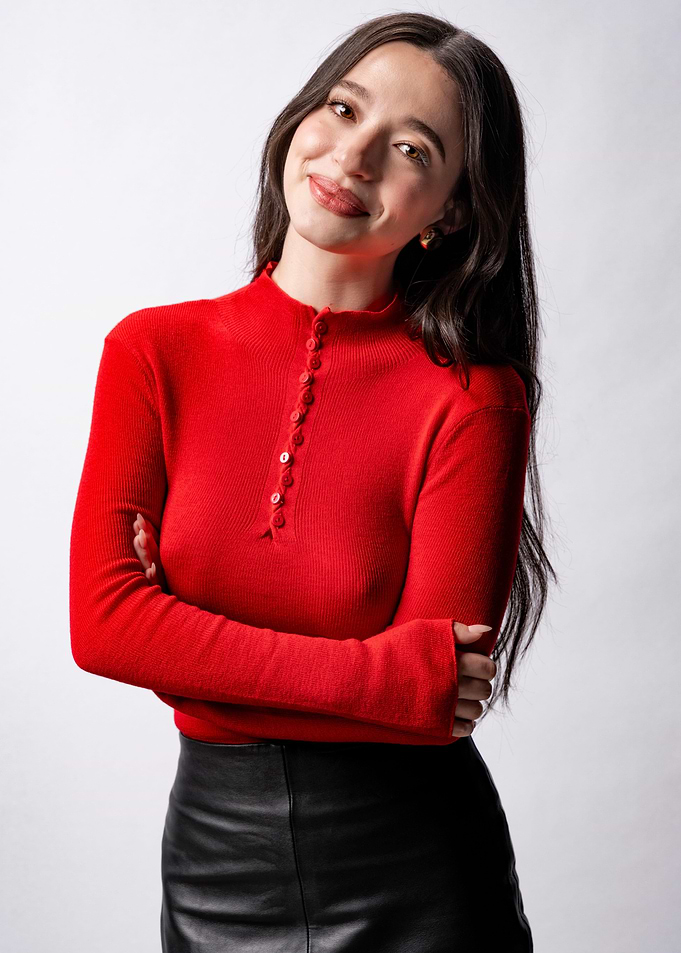 Young Woman in Red Top and Black Skirt