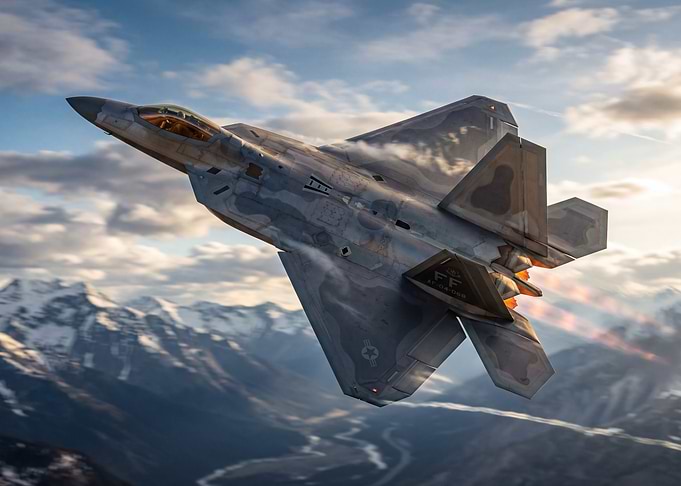 F-22 Raptor in flight over mountains