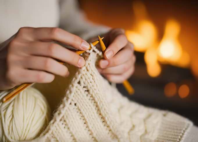 Knitting by the Fireplace