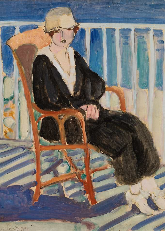 Woman in a Chair on a Balcony