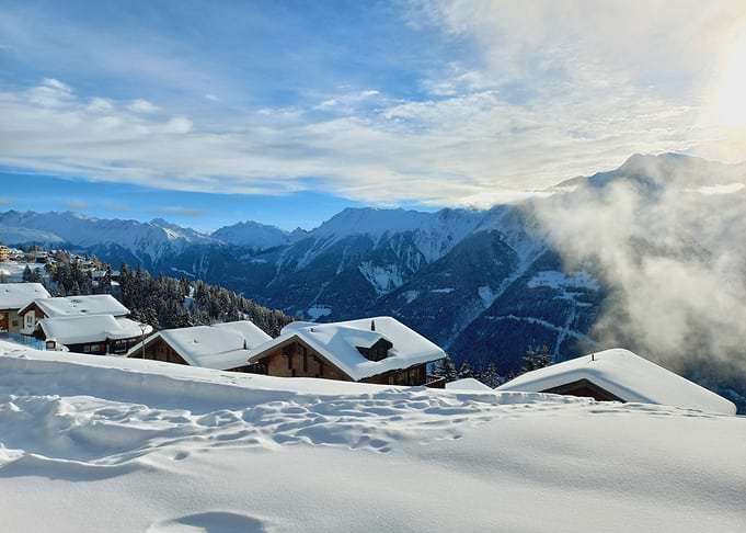 Snowy Alpine Village with Mountains