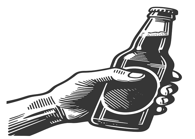Hand holding a beer bottle
