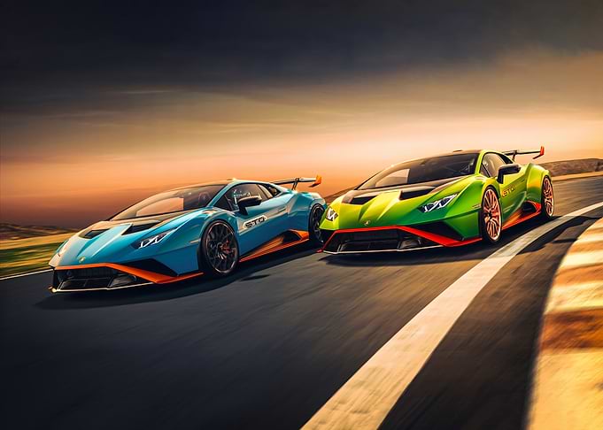 Two Lamborghinis racing on a track