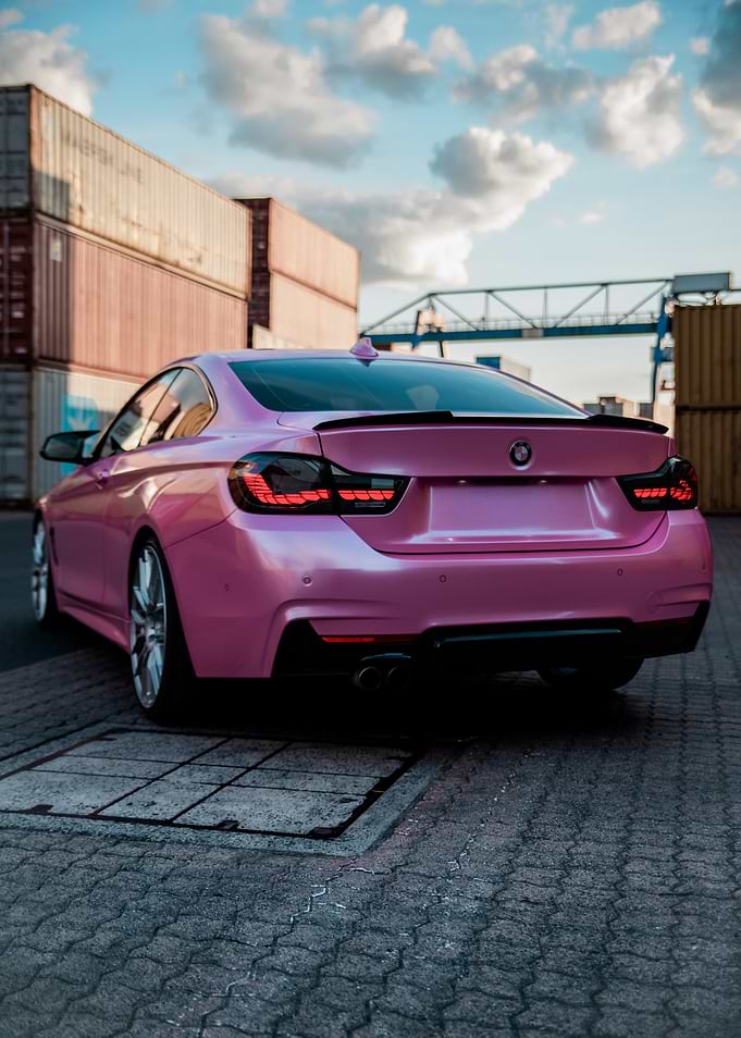 Pink BMW Coupe in Industrial Setting