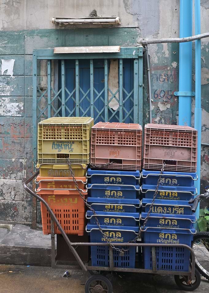 Stack of blue crates on a cart