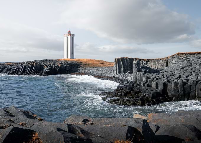 Kalfshamarsvik Lighthouse on a rocky coast