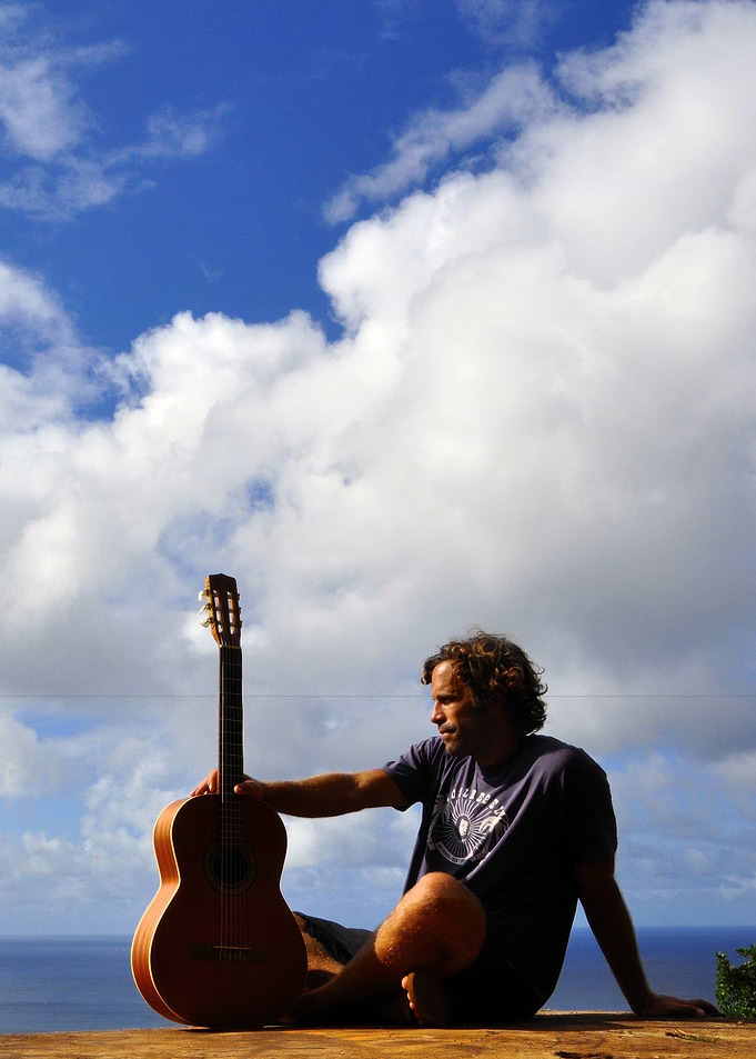 Jack Johnson with Guitar by the Ocean
