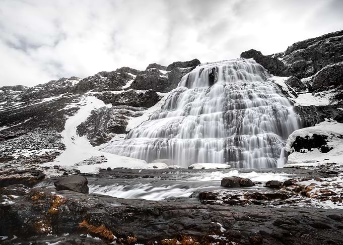 Dynjandi Waterfall in Snowy Mountains