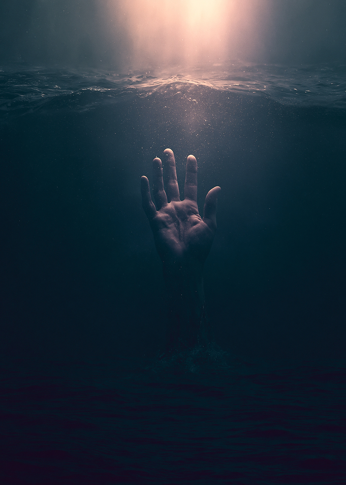 Hand reaching up from underwater