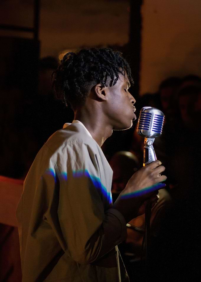 Singer performing with vintage microphone
