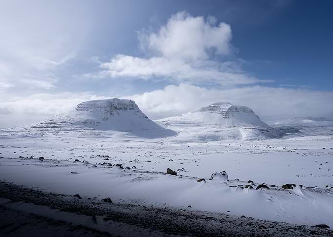 Snowy mountains under a blue sky