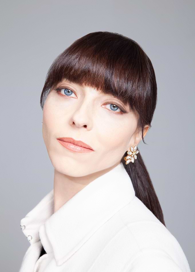 Woman with Blue Eyes and Bangs