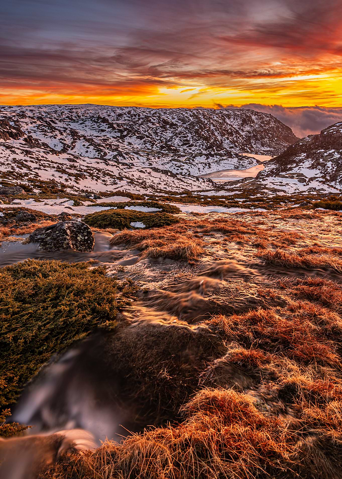 Dramatic Sunset Over Snowy Mountains