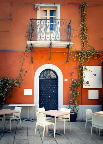Outdoor Cafe Seating with Orange Building