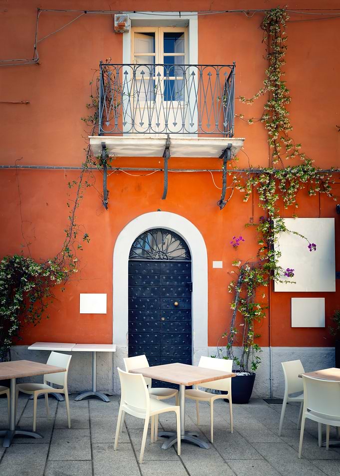 Outdoor Cafe Seating with Orange Building