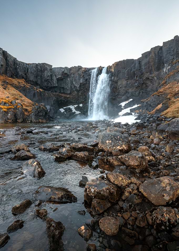 Gufufoss Waterfall in Rocky Landscape