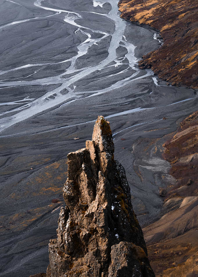 Jagged rock formation overlooking river delta