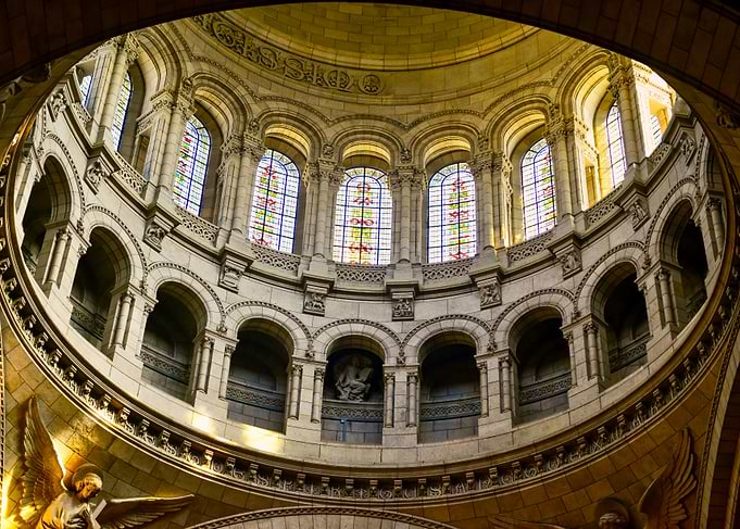 Interior of a grand dome with stained glass windows