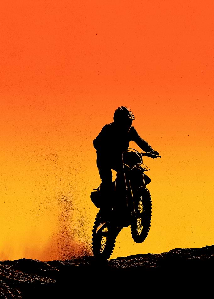 Motocross Rider Jumps at Sunset
