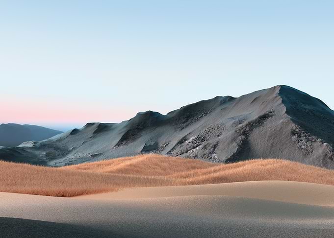 Desert Dunes and Mountains at Dawn