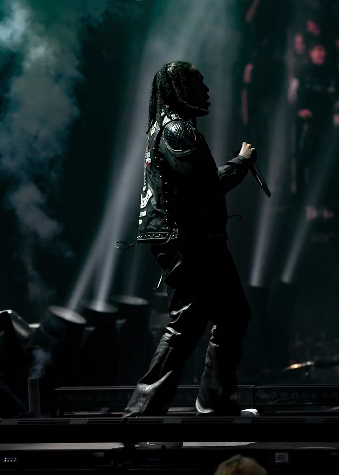 Rapper on stage with smoke and lights