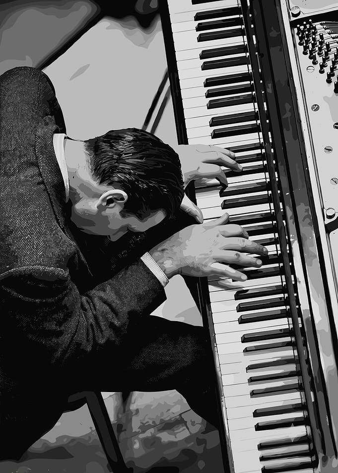 Pianist playing a grand piano