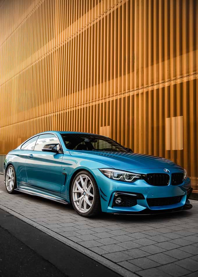 Blue BMW Coupe on Pavement