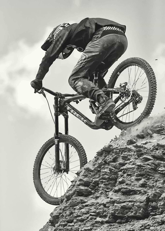 Mountain Biker Descending Rocky Terrain