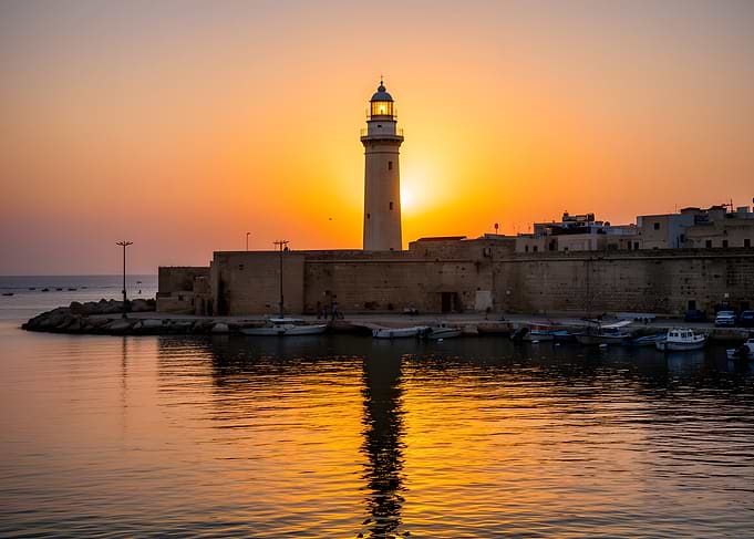 Lighthouse at Sunset Reflection