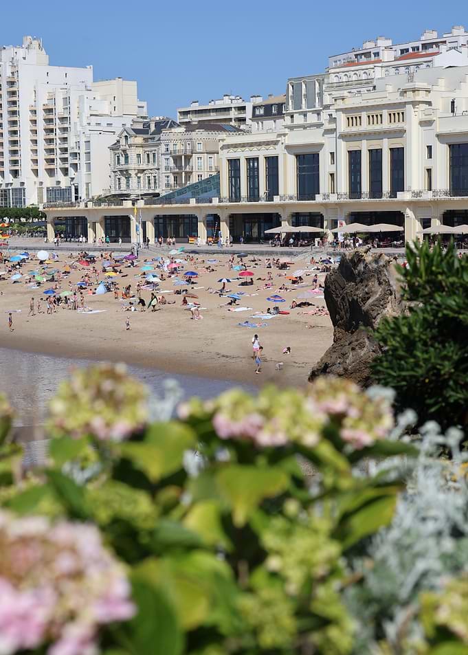Biarritz Crowded Beach with Buildings and Flowers