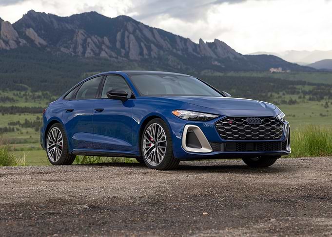 Blue Audi S8 Sedan in Mountain Landscape