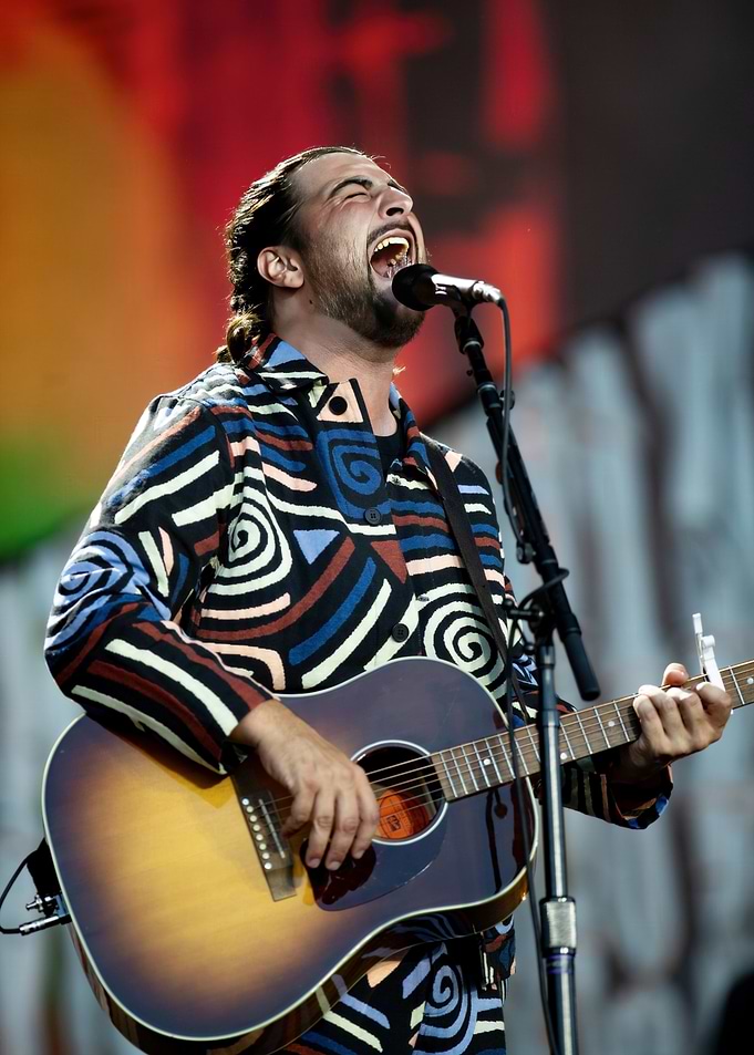 Man singing and playing guitar