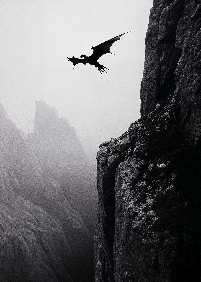 Dragon flying over misty mountains