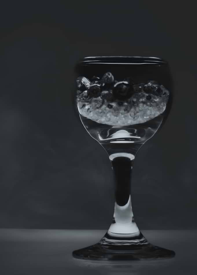 Glass of blueberries and ice