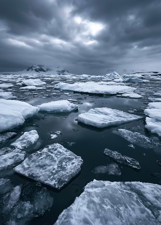 Icy Antarctic Landscape Under Stormy Skies