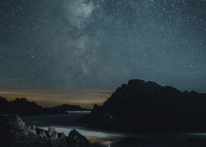 Starry Night Over Mountains and Clouds