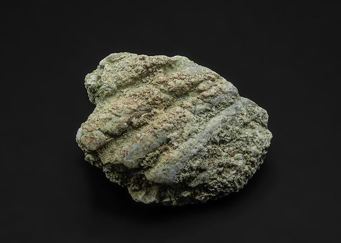 Green and beige rock specimen