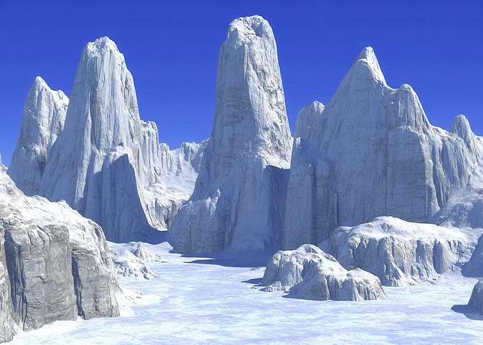 Icy Mountain Peaks Under Blue Sky
