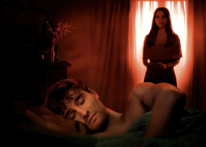 Couple in dimly lit bedroom
