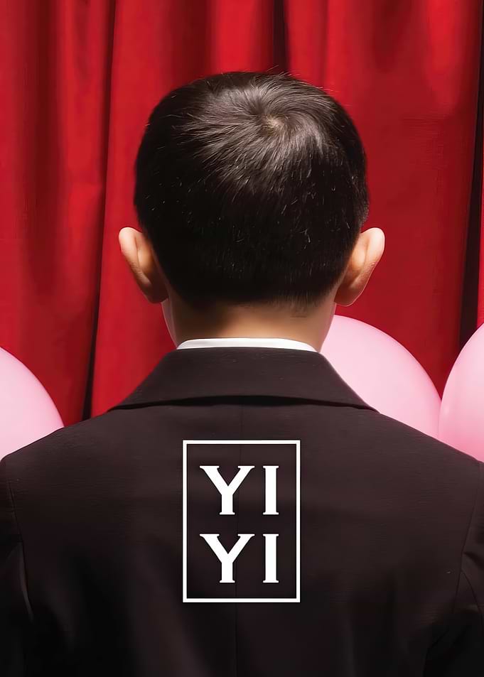 Child in Suit with 'Yi Yi' Logo
