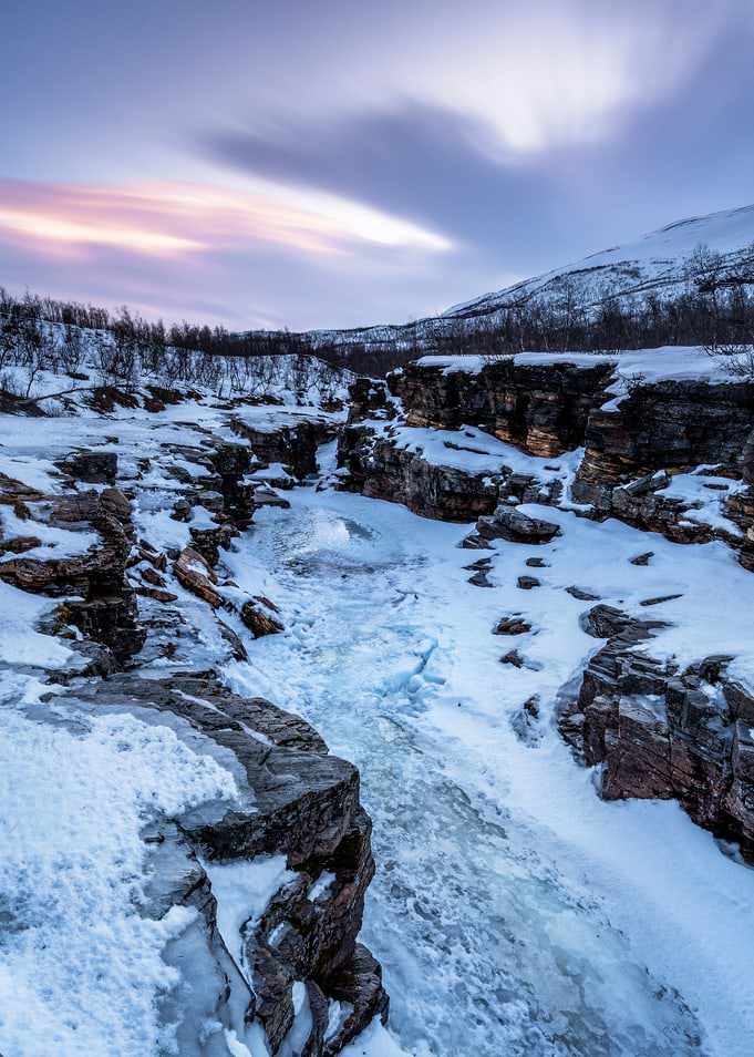Frozen River in Snowy Landscape