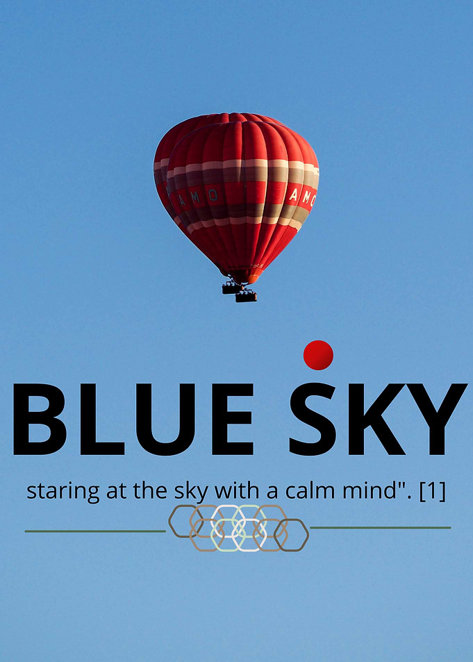 Red hot air balloon in blue sky