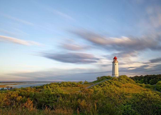 Dornbusch Lighthouse on Hiddensee at Sunset with Painterly Clouds from Long Exposure