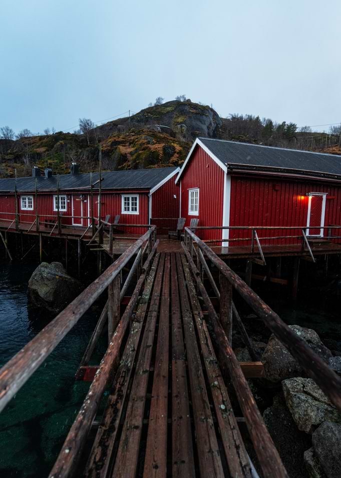 Red Fishing Huts on Wooden Pier